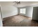 Spacious carpeted bedroom with ceiling fan and large window at 2794 Norfair Loop, Lithonia, GA 30038