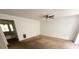Spacious living room with ceiling fan and neutral carpeting at 2794 Norfair Loop, Lithonia, GA 30038
