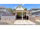 Two-story home with covered parking, fenced yard, and unique glass feature at 79 Hammock Pl, Atlanta, GA 30312