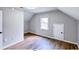 Bedroom with wood-look floors and attic access at 79 Hammock Pl, Atlanta, GA 30312