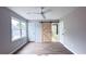 Primary bedroom with wood flooring, ceiling fan, and barn door at 79 Hammock Pl, Atlanta, GA 30312