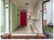 Front porch with red door and wooden flooring at 79 Hammock Pl, Atlanta, GA 30312