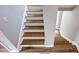 Second floor staircase with wood steps and white risers at 79 Hammock Pl, Atlanta, GA 30312