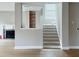 Modern staircase with built-in shelving and hardwood floors at 79 Hammock Pl, Atlanta, GA 30312