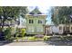 Charming two-story green house with landscaped yard at 79 Hammock Pl, Atlanta, GA 30312