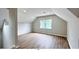 Spacious loft area with wood-look floors and large windows at 79 Hammock Pl, Atlanta, GA 30312