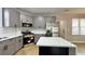Modern kitchen with gray cabinets, stainless steel appliances, and a large island at 79 Hammock Pl, Atlanta, GA 30312