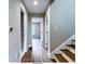 Second floor hallway with wood flooring and access to bedrooms at 79 Hammock Pl, Atlanta, GA 30312