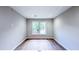 Bright bedroom with hardwood floors and a large window at 79 Hammock Pl, Atlanta, GA 30312