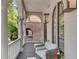 Front porch features a wicker chair and view of the street at 6710 Center Grove St, Cumming, GA 30040