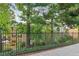 Building exterior with gated entrance and landscaping at 750 Dalrymple Rd # C1, Atlanta, GA 30328