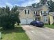 Two-story house with double garage and manicured lawn at 1080 Meadow Walk Ave, Lawrenceville, GA 30044