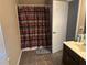 Clean bathroom with shower/tub combo, vanity, and tile floor at 1080 Meadow Walk Ave, Lawrenceville, GA 30044