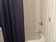 Bathroom with a shower/tub combination and white tile at 1080 Meadow Walk Ave, Lawrenceville, GA 30044