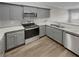 Modern kitchen featuring gray cabinets, granite countertops, and stainless steel appliances at 106 Squarewood Ln, Cartersville, GA 30121