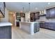 Modern kitchen with gray cabinets, stainless steel appliances and large island at 2006 Fontainbleau Dr, Conyers, GA 30094