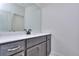 Vanity with white countertop and gray cabinets at 2006 Fontainbleau Dr, Conyers, GA 30094