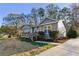 Gray house with wooden deck, and x-shaped shutters at 65 Hickory Cir, Carrollton, GA 30116