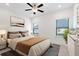 Spacious bedroom with a king-size bed, two windows, and neutral decor at 3701 Allegretto Cir, Atlanta, GA 30339