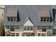 Close-up view of the townhome roofs with dormers and metal accents at 3701 Allegretto Cir, Atlanta, GA 30339