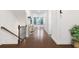 Bright hallway with hardwood floors leading to the living area and upstairs at 3701 Allegretto Cir, Atlanta, GA 30339