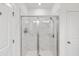 Walk-in shower with marble tile and glass enclosure at 3701 Allegretto Cir, Atlanta, GA 30339