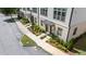 Front view of townhomes with landscaping and sidewalk at 3701 Allegretto Cir, Atlanta, GA 30339