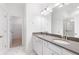 Bathroom with double vanity, large mirror, and walk-in shower at 3701 Allegretto Cir, Atlanta, GA 30339