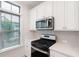 Kitchen features white cabinets, stainless steel appliances, and quartz countertops at 3701 Allegretto Cir, Atlanta, GA 30339
