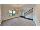 Formal dining room with neutral carpeting and wainscoting at 9378 Lantana Trl, Jonesboro, GA 30238