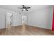 Spacious bedroom with wood-look flooring and ceiling fan at 6851 Roswell Rd # B8, Sandy Springs, GA 30328
