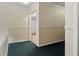 Upper hallway with carpet and door to another room at 6851 Roswell Rd # B8, Sandy Springs, GA 30328