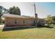 Brick home with deck and a partially visible yard at 7928 S Giles Rd, Douglasville, GA 30135