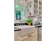 Ornate apron sink and granite countertops in a farmhouse kitchen at 161 Blair Valley Ne Dr, Marietta, GA 30060