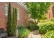 Landscaped walkway with brick path, lush greenery, and a serene atmosphere at 161 Blair Valley Ne Dr, Marietta, GA 30060