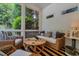 Relaxing screened porch with wicker furniture and striped pillows at 161 Blair Valley Ne Dr, Marietta, GA 30060