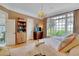 Spacious main bedroom with large windows, chandelier, and a sitting area at 161 Blair Valley Ne Dr, Marietta, GA 30060