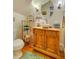Charming powder room featuring a wooden vanity and decorative mirror at 161 Blair Valley Ne Dr, Marietta, GA 30060
