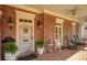 Charming front porch with rocking chairs and brick flooring at 161 Blair Valley Ne Dr, Marietta, GA 30060