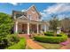 Charming two-story brick home with a welcoming front porch and landscaping at 161 Blair Valley Ne Dr, Marietta, GA 30060