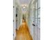 Bright hallway with hardwood floors and French doors leading outdoors at 161 Blair Valley Ne Dr, Marietta, GA 30060