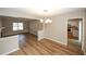 Bright dining room with hardwood floors and chandelier at 707 Arbor Hill Dr, Stone Mountain, GA 30088