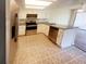 Galley kitchen with stainless steel appliances at 1084 Village Main St, Stone Mountain, GA 30088