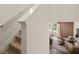 Modern staircase leading to the upper level with a view of the living room at 318 Elgin Dr, Lawrenceville, GA 30045