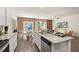 Open kitchen with island, granite countertops, and stainless steel appliances at 318 Elgin Dr, Lawrenceville, GA 30045