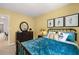 Bedroom with teal bedding and dresser at 318 Elgin Dr, Lawrenceville, GA 30045