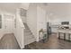 Bright and spacious entryway with hardwood floors and staircase at 318 Elgin Dr, Lawrenceville, GA 30045