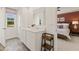 Shared bathroom with double vanity and view into the main bedroom at 318 Elgin Dr, Lawrenceville, GA 30045