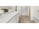 Bright bathroom boasts double sinks, marble countertop, and shower at 318 Elgin Dr, Lawrenceville, GA 30045