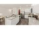 White kitchen with granite countertops and stainless steel appliances at 318 Elgin Dr, Lawrenceville, GA 30045